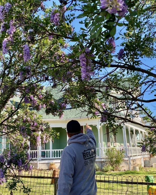 Recon Roofing crew member inspecting a home in Central Texas
