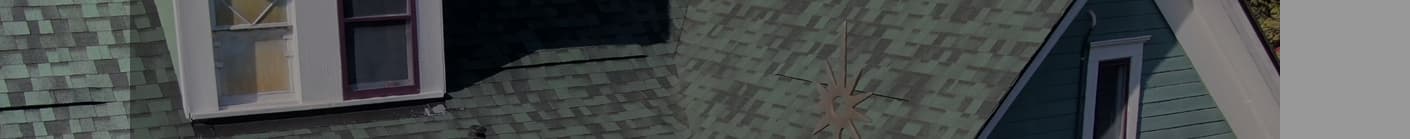Close-up aerial of roof valley and shingle detail work on a completed project