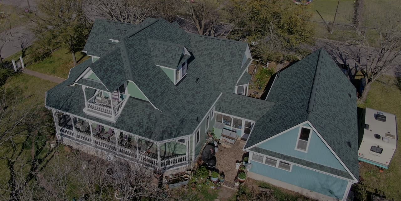 Aerial view of a completed residential roof in Central Texas