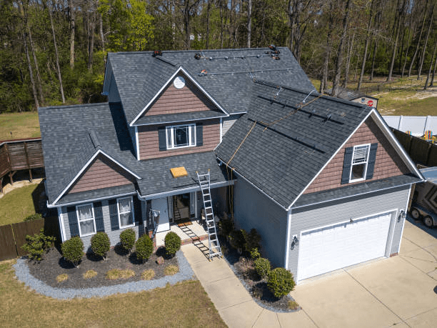 Recon Roofing crew working on a home in Temple, TX