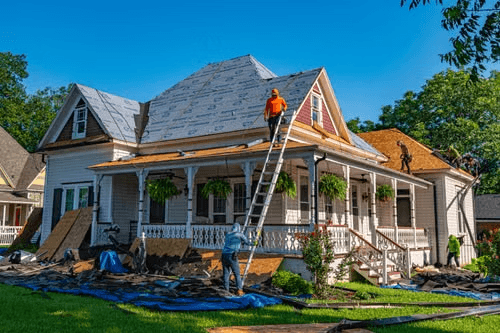 Recon Roofing crew working on a home in Taylor, TX